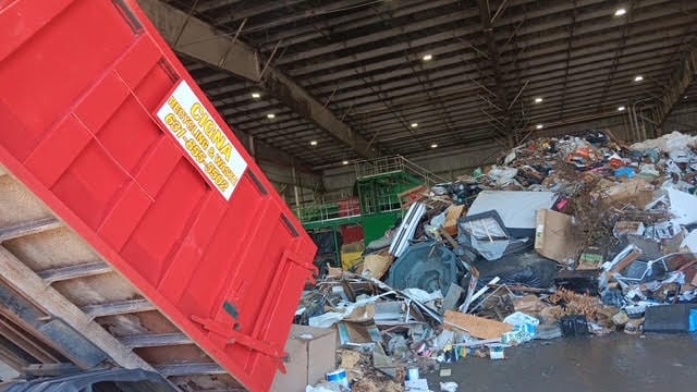 Full dumpster ready for pickup after renovation