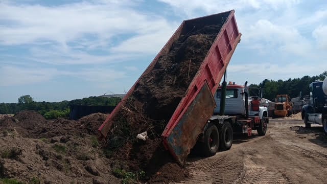 Clean job site after dumpster pickup and haul-away